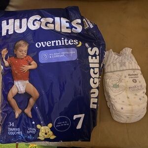 Opened Huggies size 7 nighttime diapers 23 left